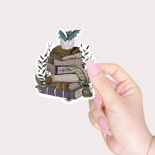 Book stack and baby dragon sticker