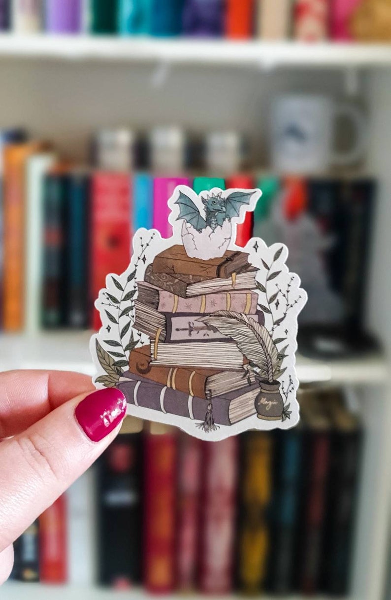 Book stack and baby dragon sticker