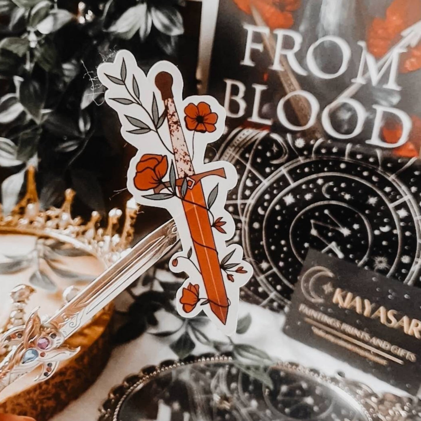 Red fantasy book dagger with vines and flowers