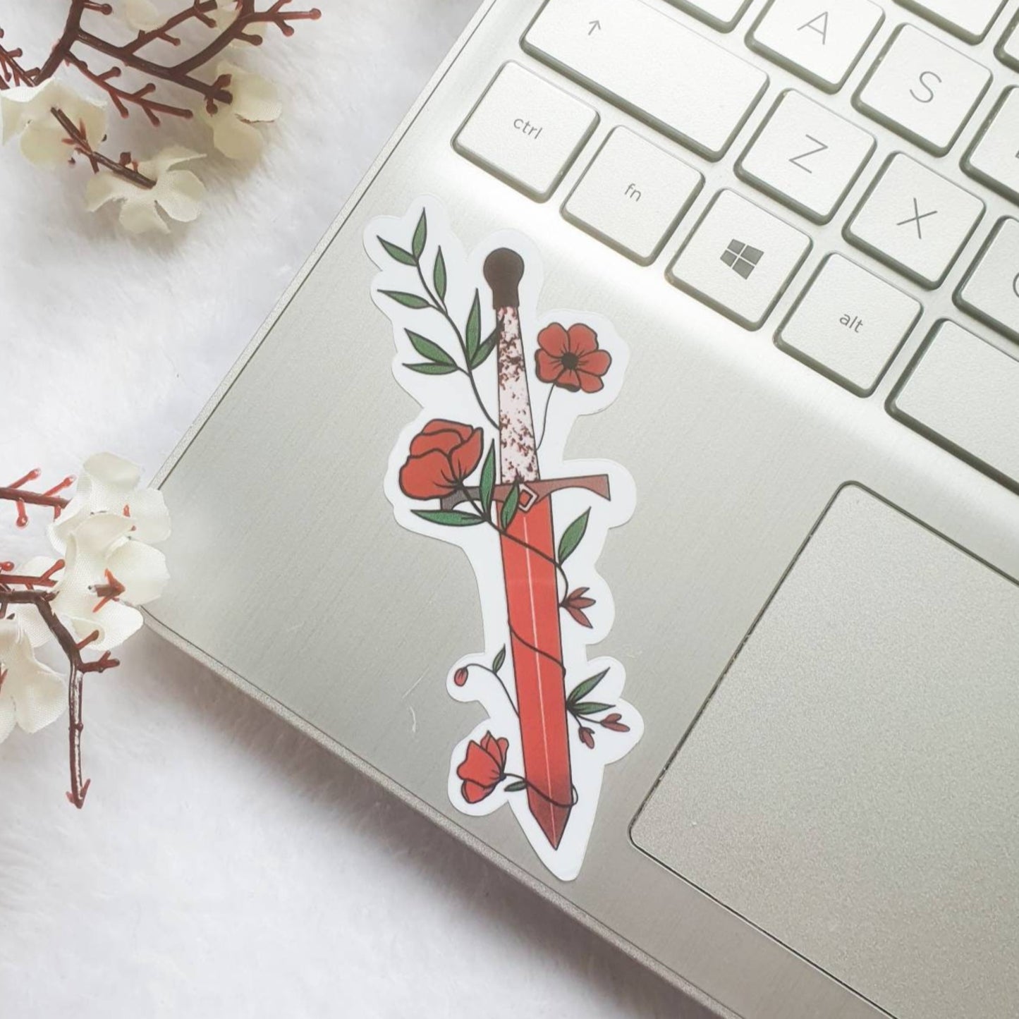 Red fantasy book dagger with vines and flowers