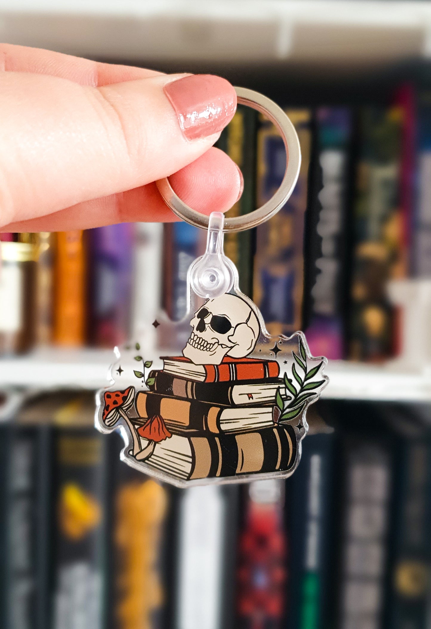 Dark academia book stack and skull keychain