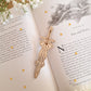 Sword and bow shaped engraved wooden bookmark