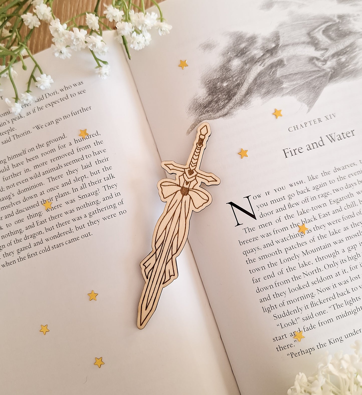 Sword and bow shaped engraved wooden bookmark