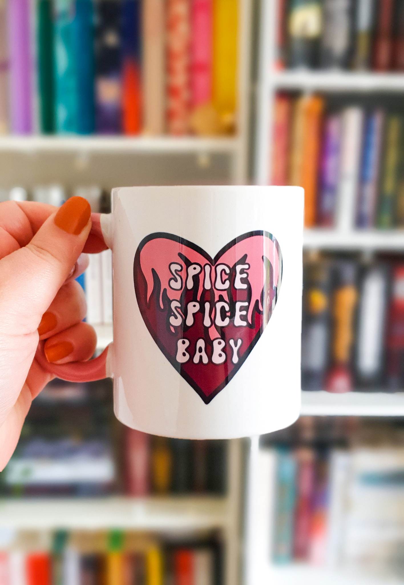 Spicy books 11oz ceramic mug with pink handle