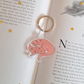 Pink sleeping dragon keyring