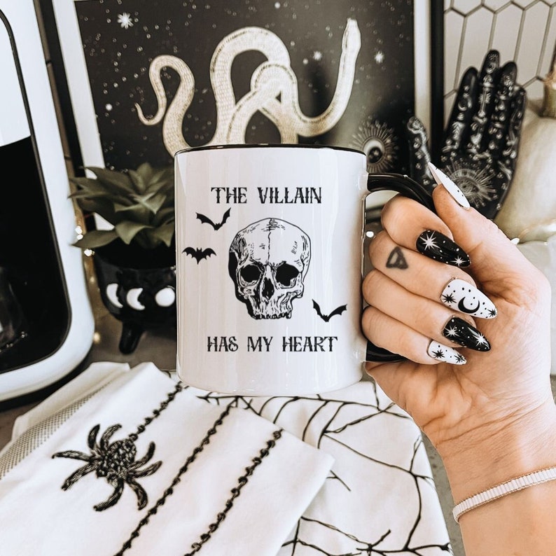 The villain has my heart ceramic mug with black handle