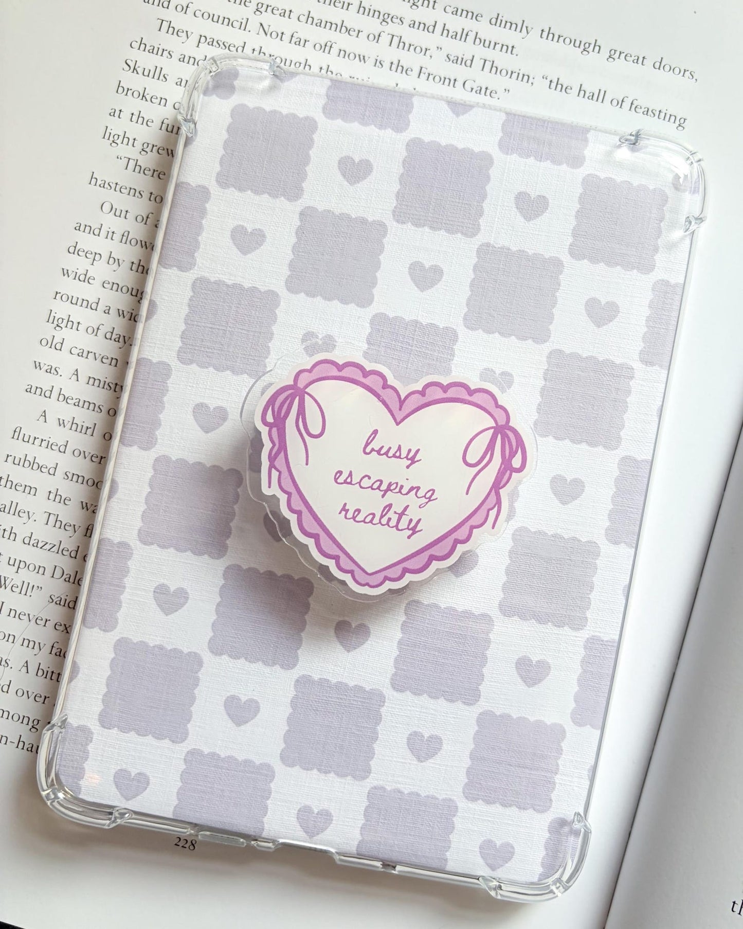 Busy escaping reality heart shaped kindle/phone grip