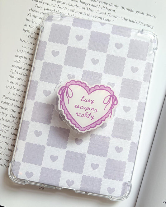 Busy escaping reality heart shaped kindle/phone grip