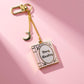Busy reading pink and gold enamel kindle/phone charm