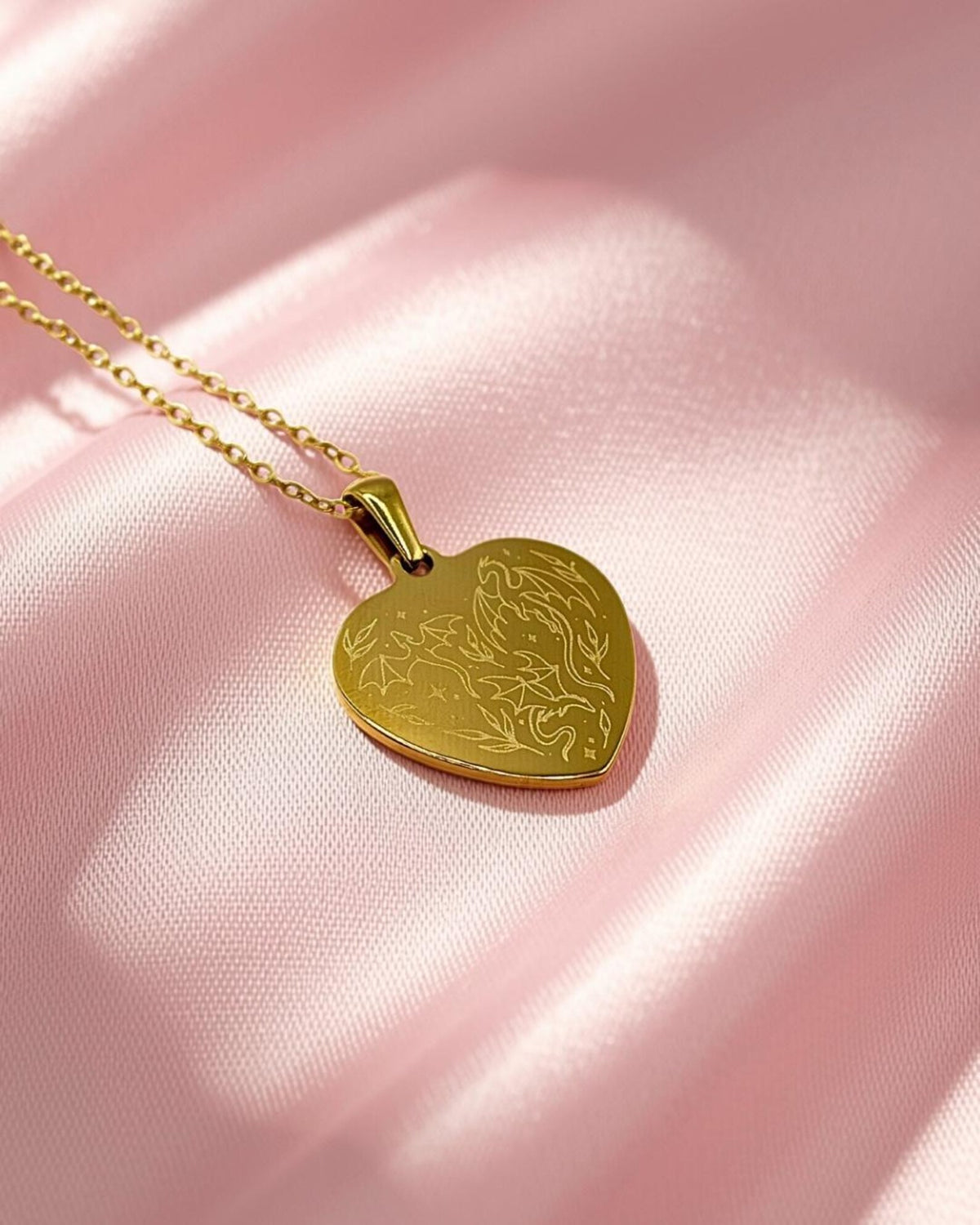 Gold plated heart shaped dragon engraved necklace