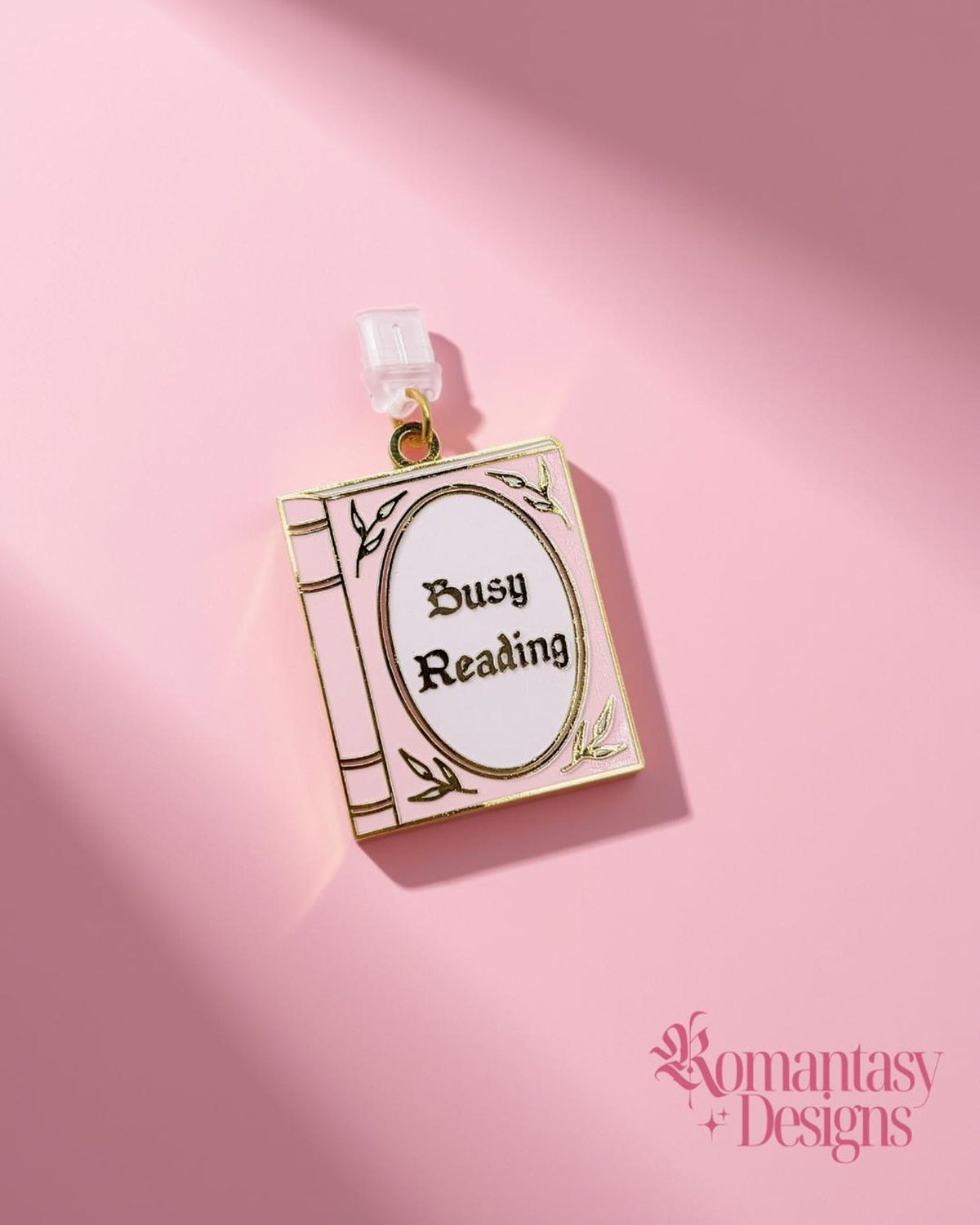 Busy reading pink and gold enamel kindle/phone dust plug charm