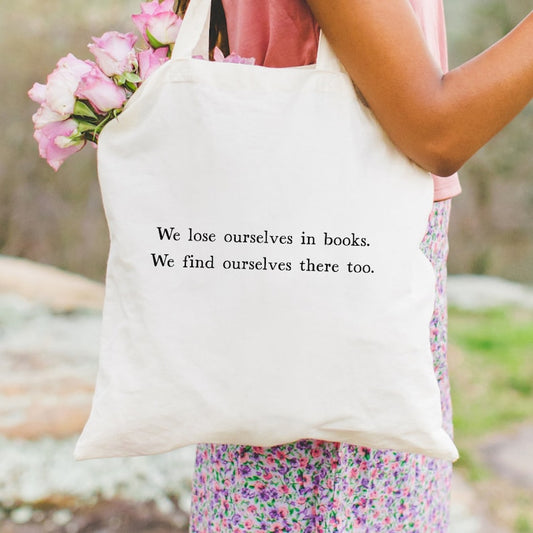 We lose ourselves in books cotton tote bag