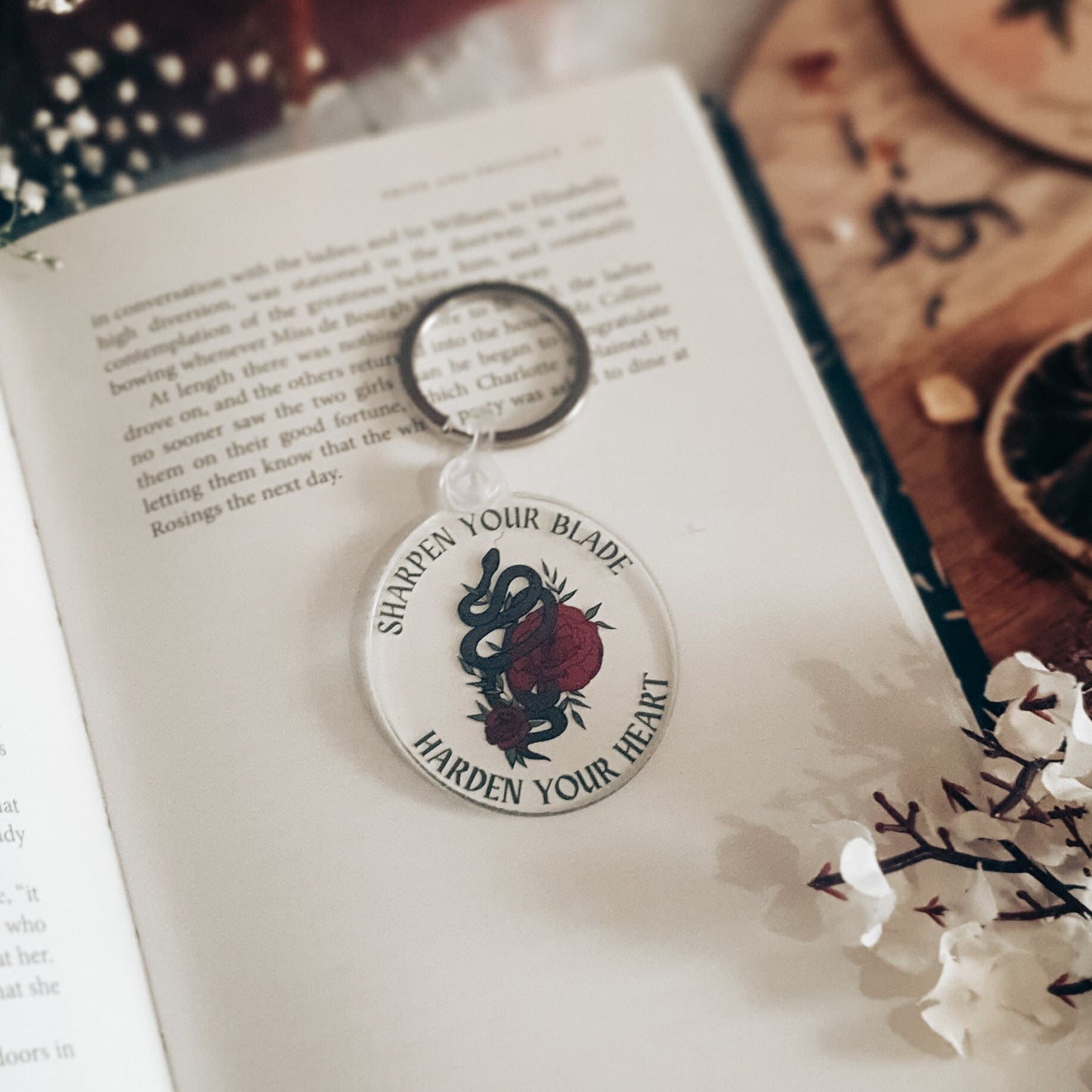 The cruel prince acrylic keyring with floral snake design