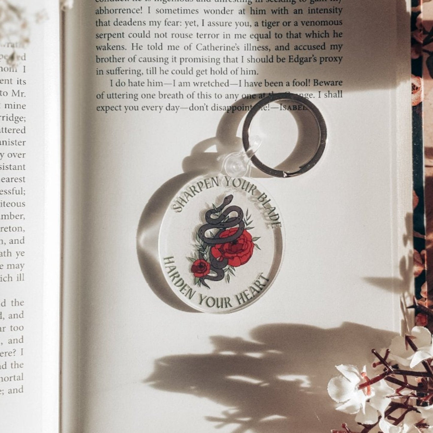 The cruel prince acrylic keyring with floral snake design