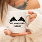 A woman holding a white mug with a picture of black wings on it and the words big wingspan energy