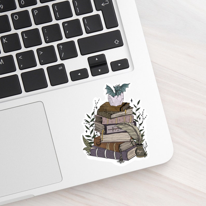Book stack and baby dragon sticker