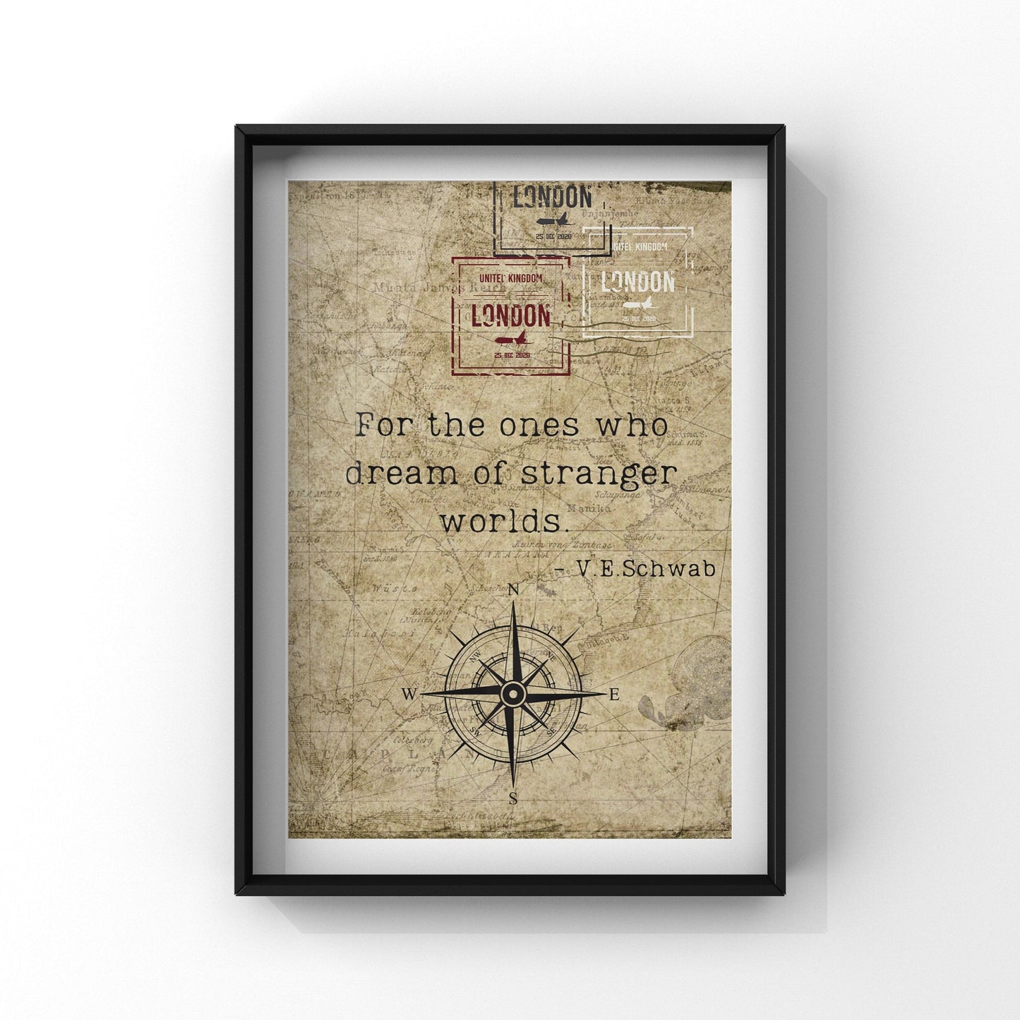 a framed beige print with book quote and a compass design