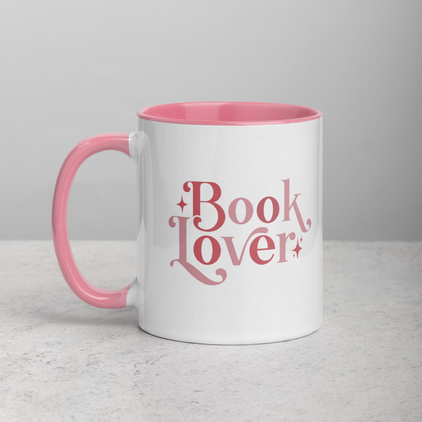 Book Lover 11oz ceramic mug with pink handle and inside
